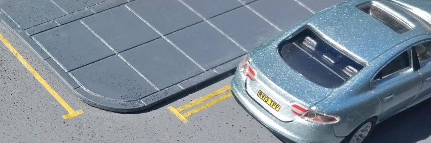 Die cast model car on pavement