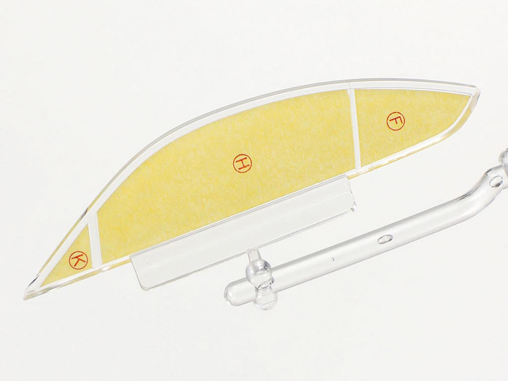 Glass object with yellow interior and silver exterior on a white background