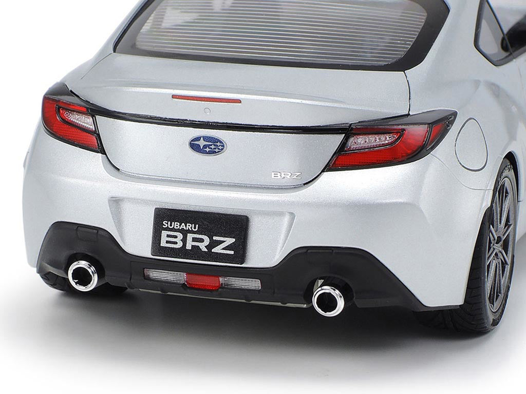 Back view of a silver Subaru BRZ car on a white background