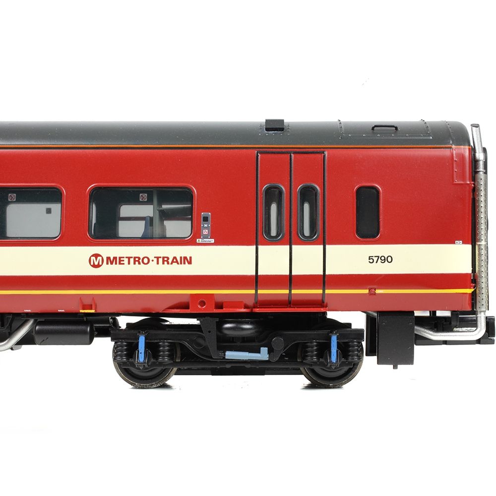 Model train car with 'Metro-Train' branding on a white background
