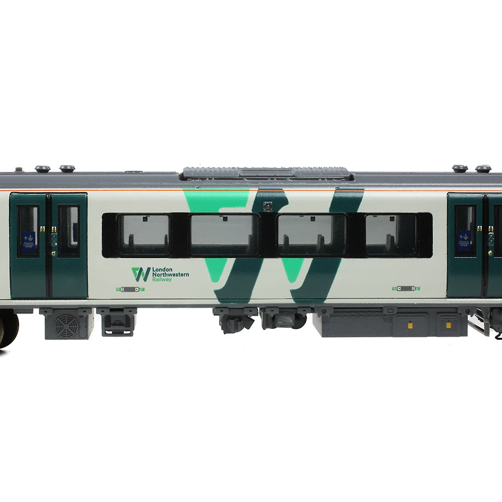 Model train car with green and gray design on a white background