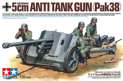 Model kit of a German 5cm Anti-Tank Gun Pak38 with soldiers and accessories on a desert background.