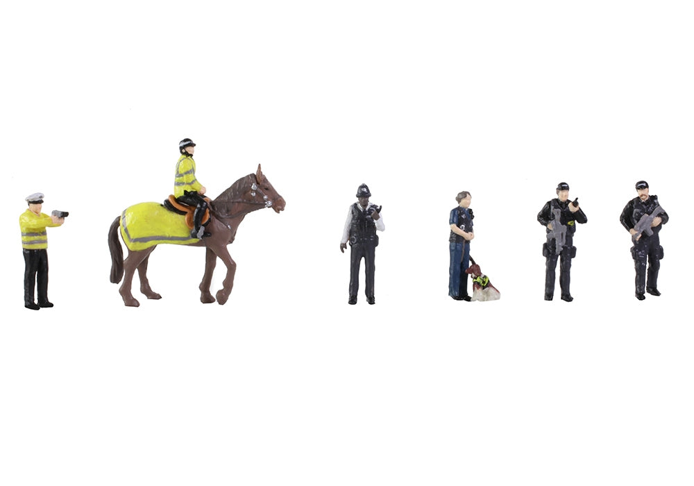 Set of toy figures including a horse and five police officers on a white background