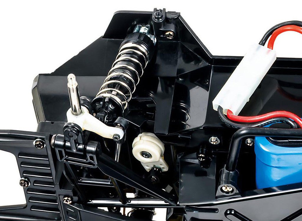 Close-up view of the updated suspension system in the Tamiya Lunch Box EVO (58755) RC Monster Truck kit.