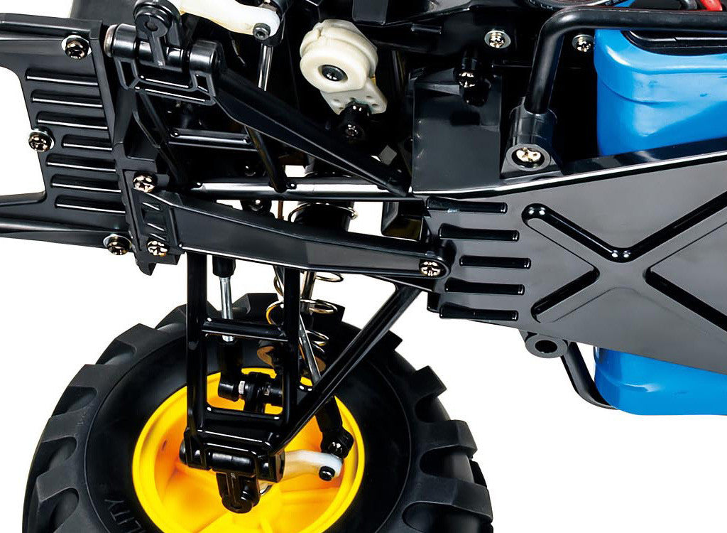 Detail of Tamiya Lunch Box EVO (58755) suspension and wheel assembly, showcasing its updated design.