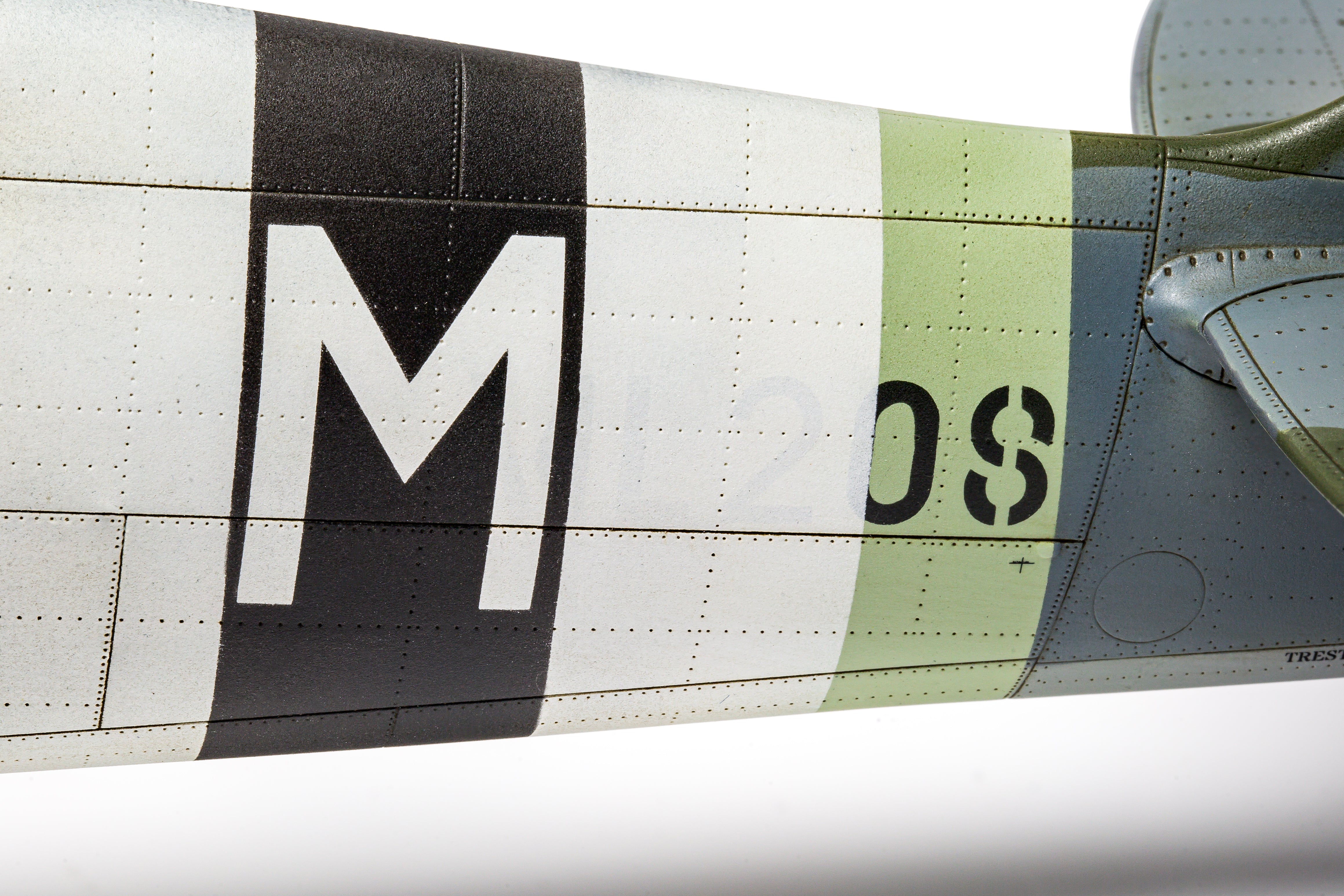 Close-up of an airplane wing with visible branding and text