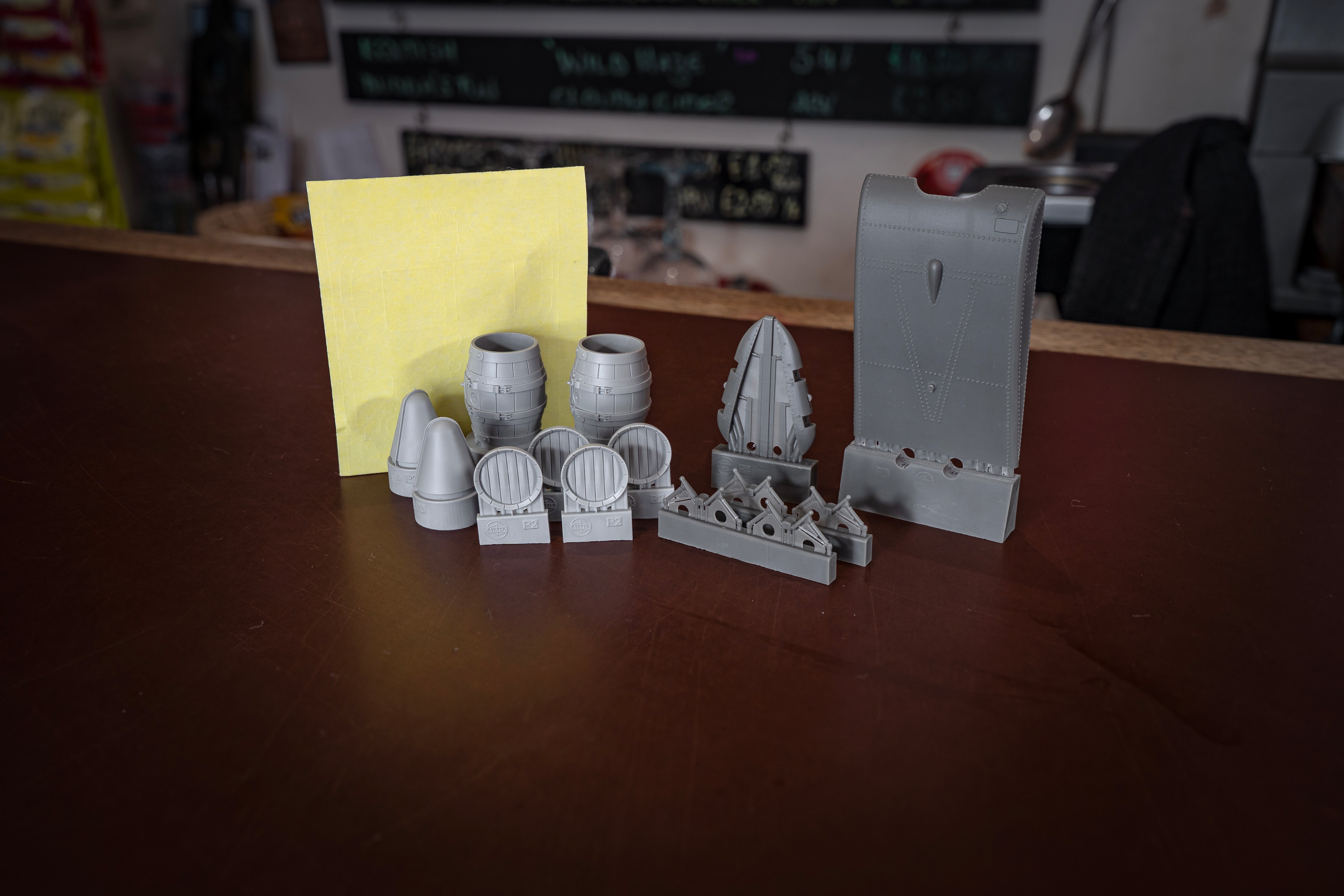 Collection of 3D-printed models on a wooden surface with a blurred background