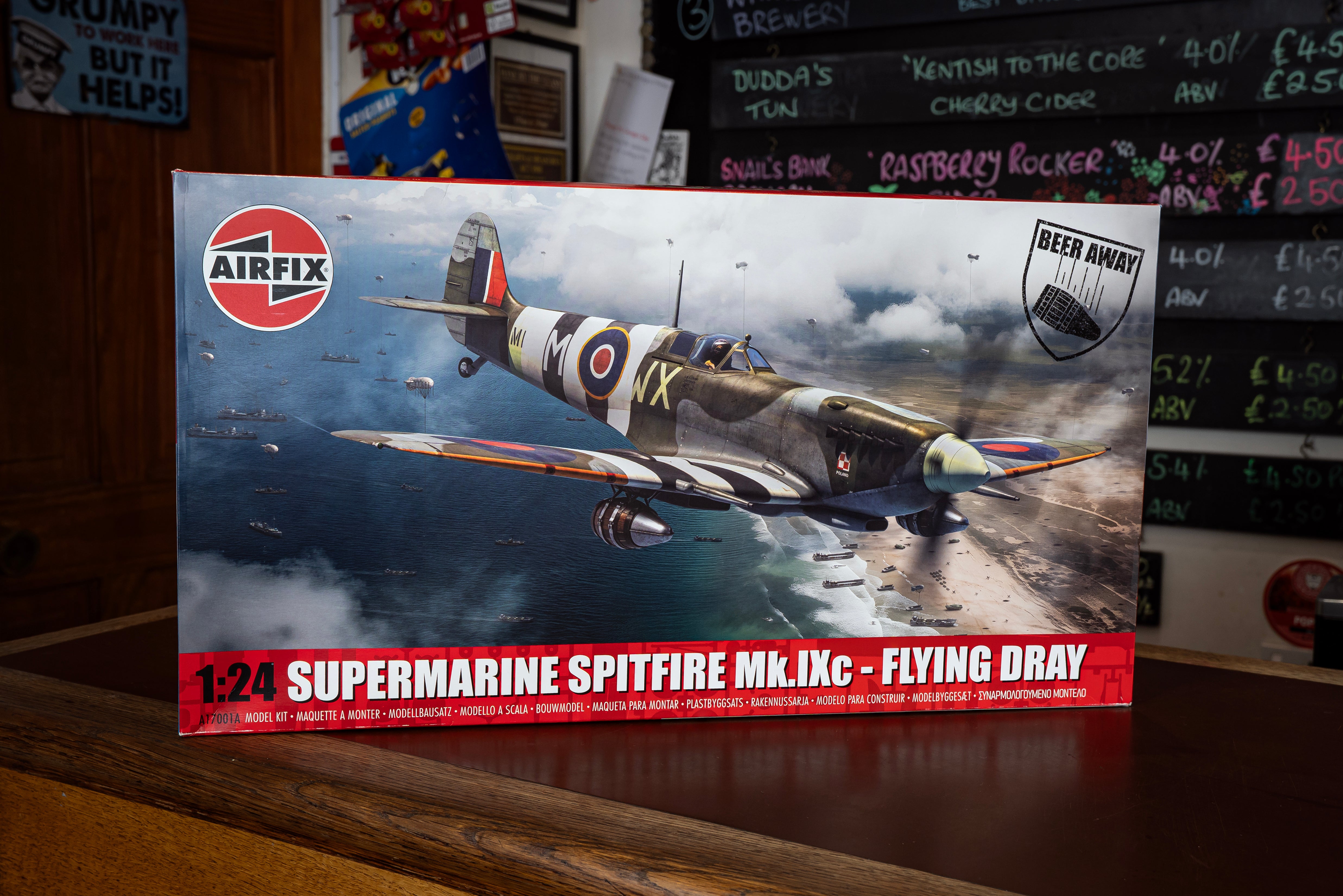 Airfix Supermarine Spitfire Mk.IXc model kit packaging on a wooden surface