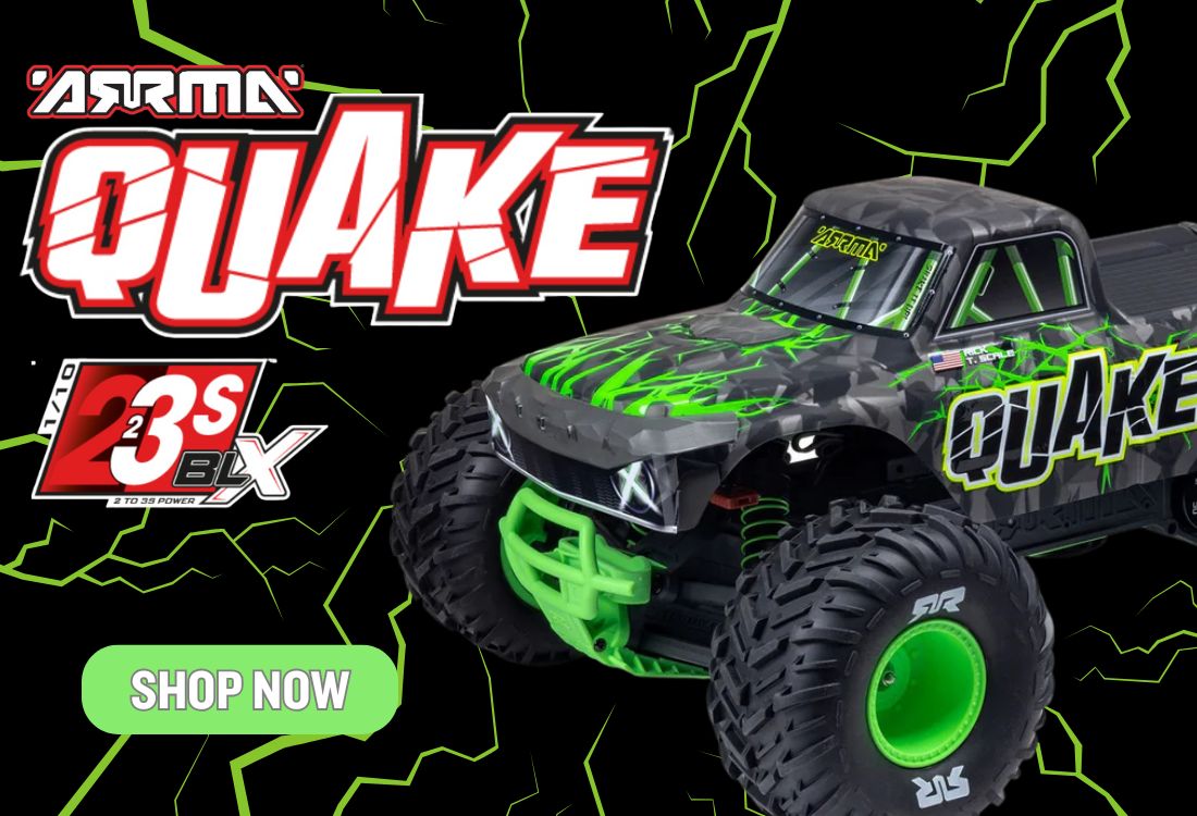 Toy monster truck with 'Arma' branding and 'Quake' on a black background with green accents.