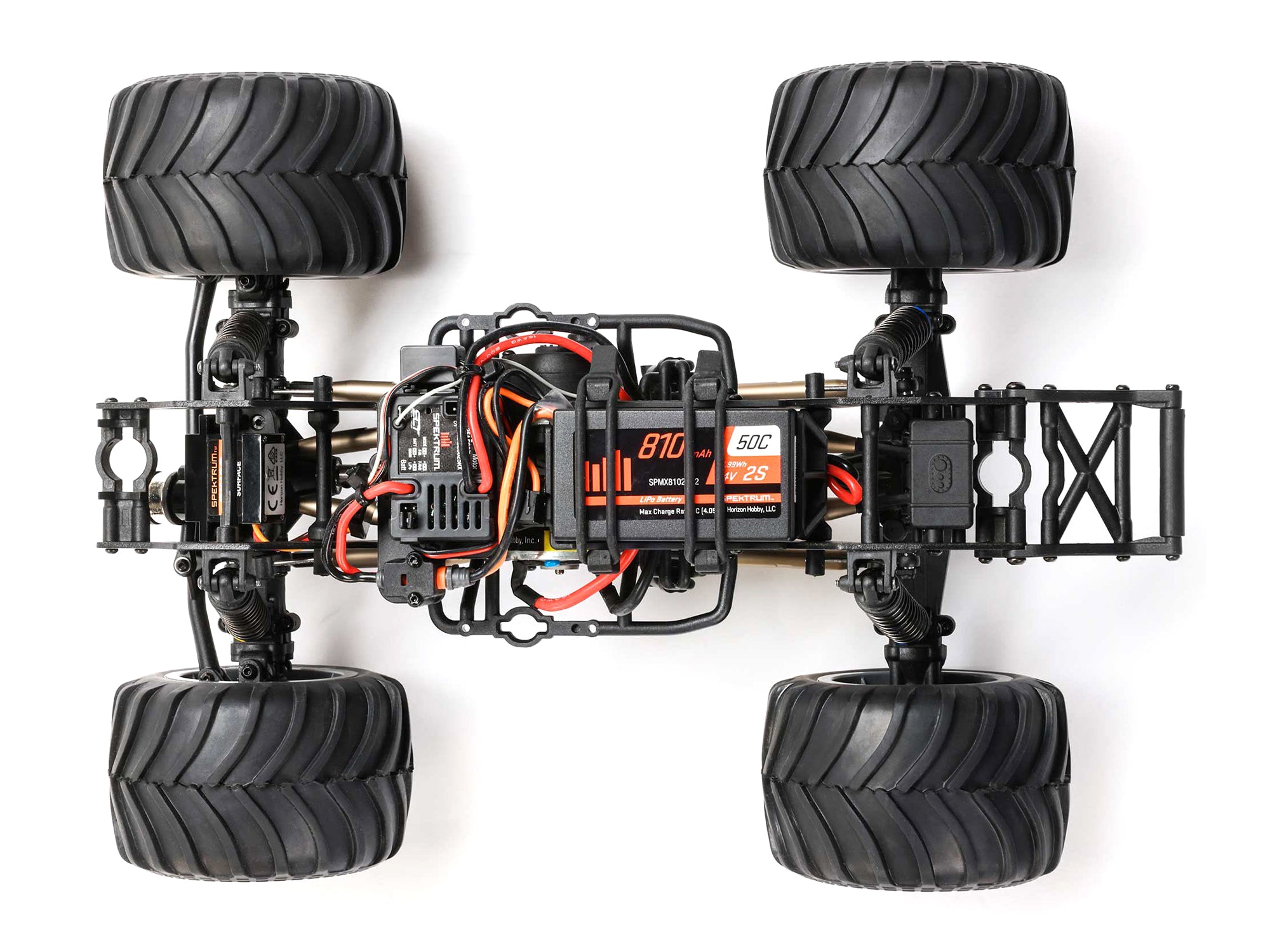 Losi 1/18 Mini LMT Zombie Monster Truck chassis view showcasing the large tires and internal components.