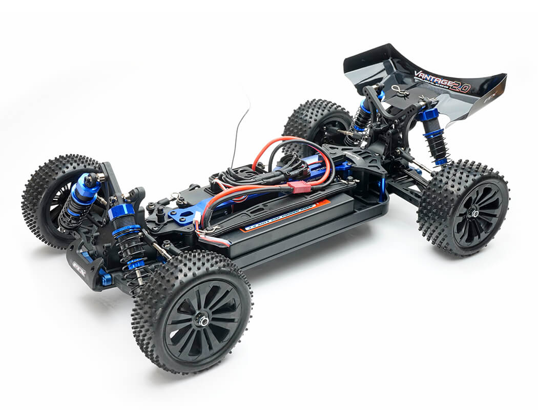 Unassembled RC car chassis with visible wiring on a white background