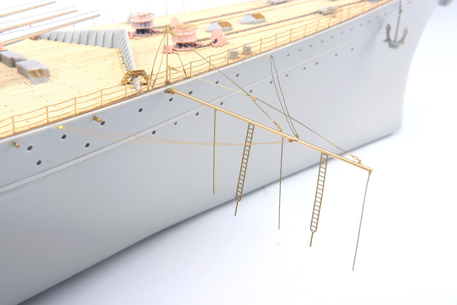 Detailed view of DKM Scharnhorst model kit featuring brass ladders and ship detailing parts.