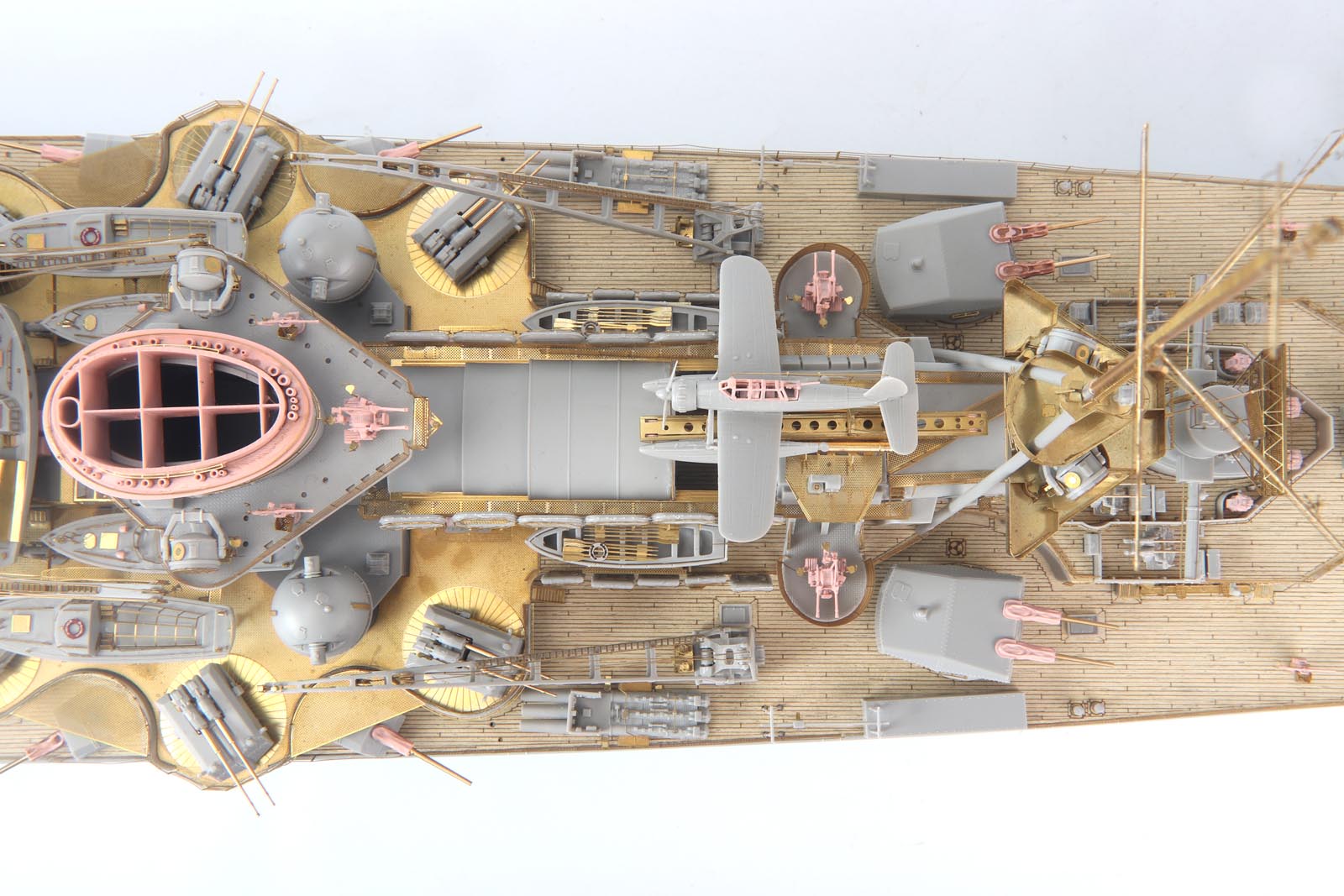 DKM Scharnhorst model kit showing detailed etched brass parts and wood deck in 1/200 scale.