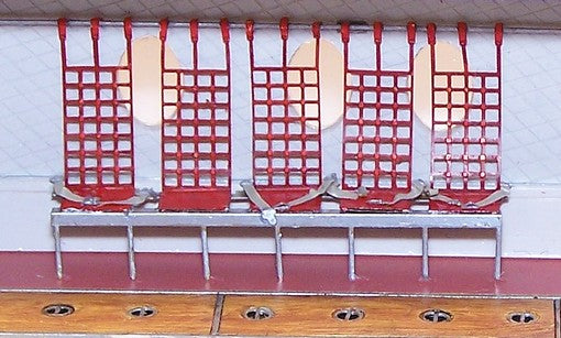 U.S. Universal cargo area seats and seatbelts. Photoetched coloured sheet. Set contains 23 seats with belts. Madde by Eduard.