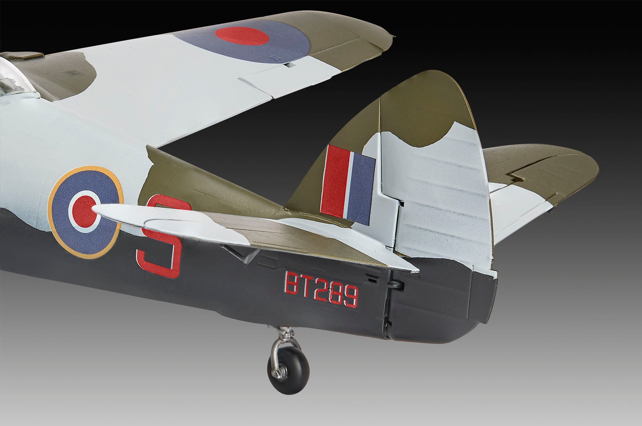 Model of a vintage airplane with camouflage design on a gradient background