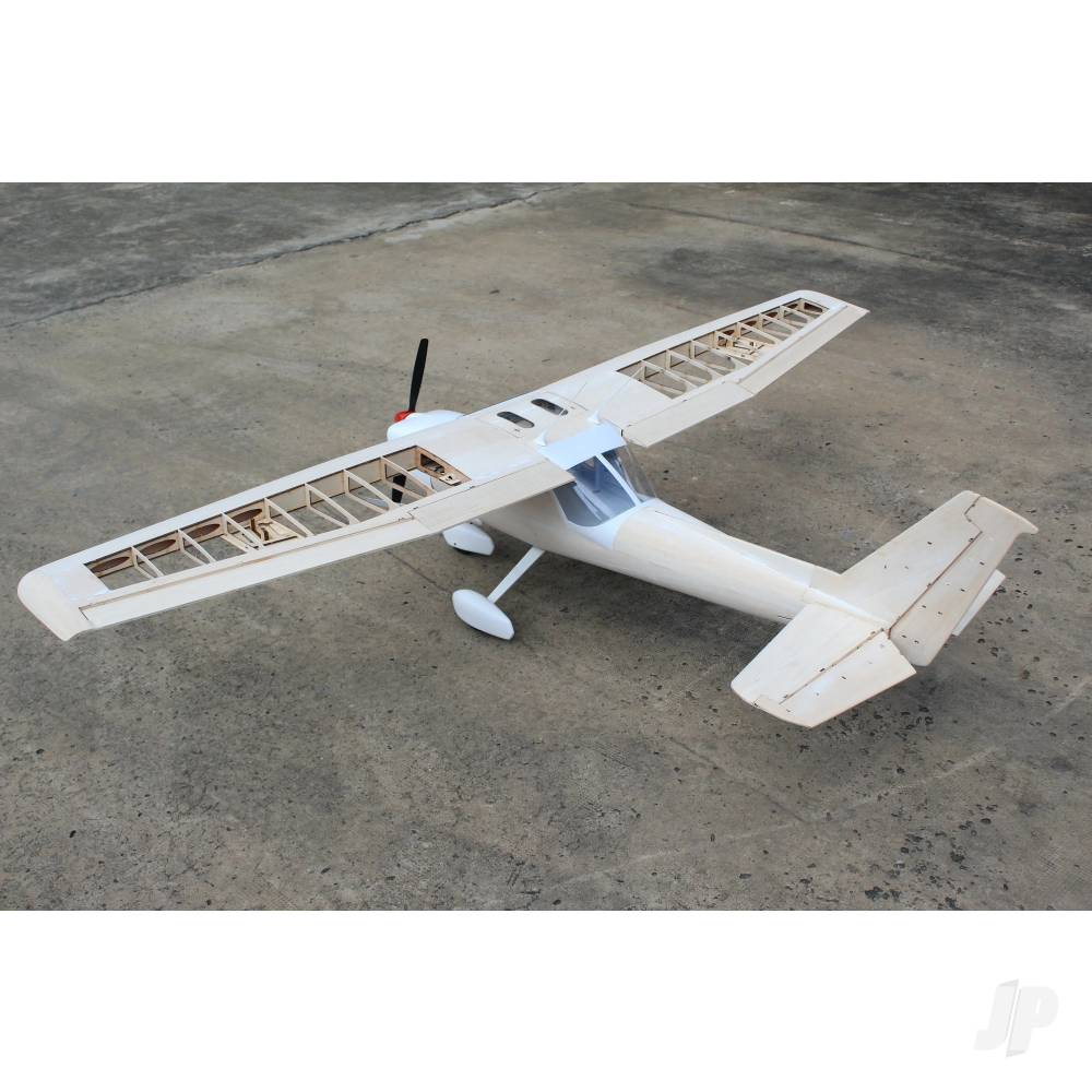 White model airplane on a concrete surface
