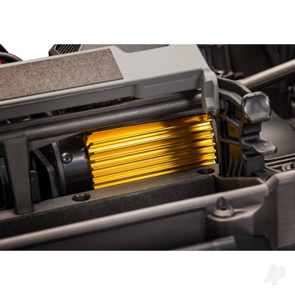 Close-up of a mechanical component with gold-colored elements inside a gray casing.