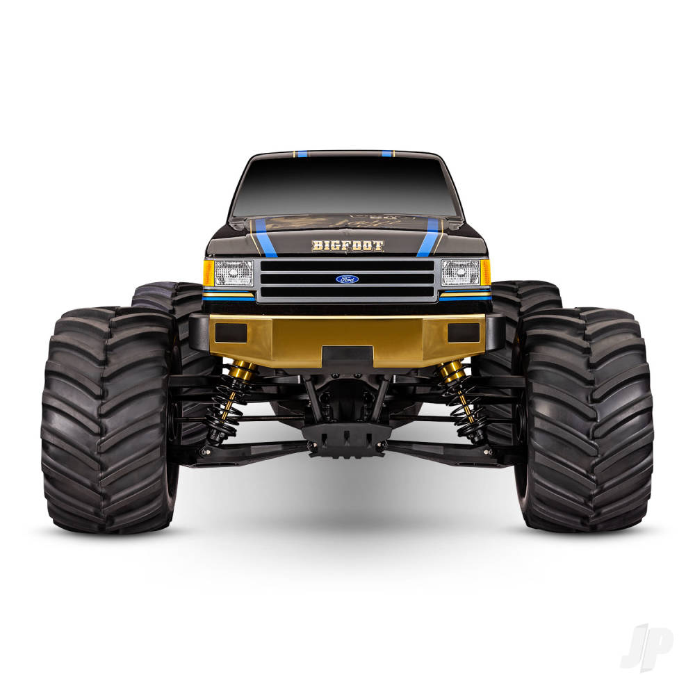 Model of a Ford monster truck with large wheels on a white background