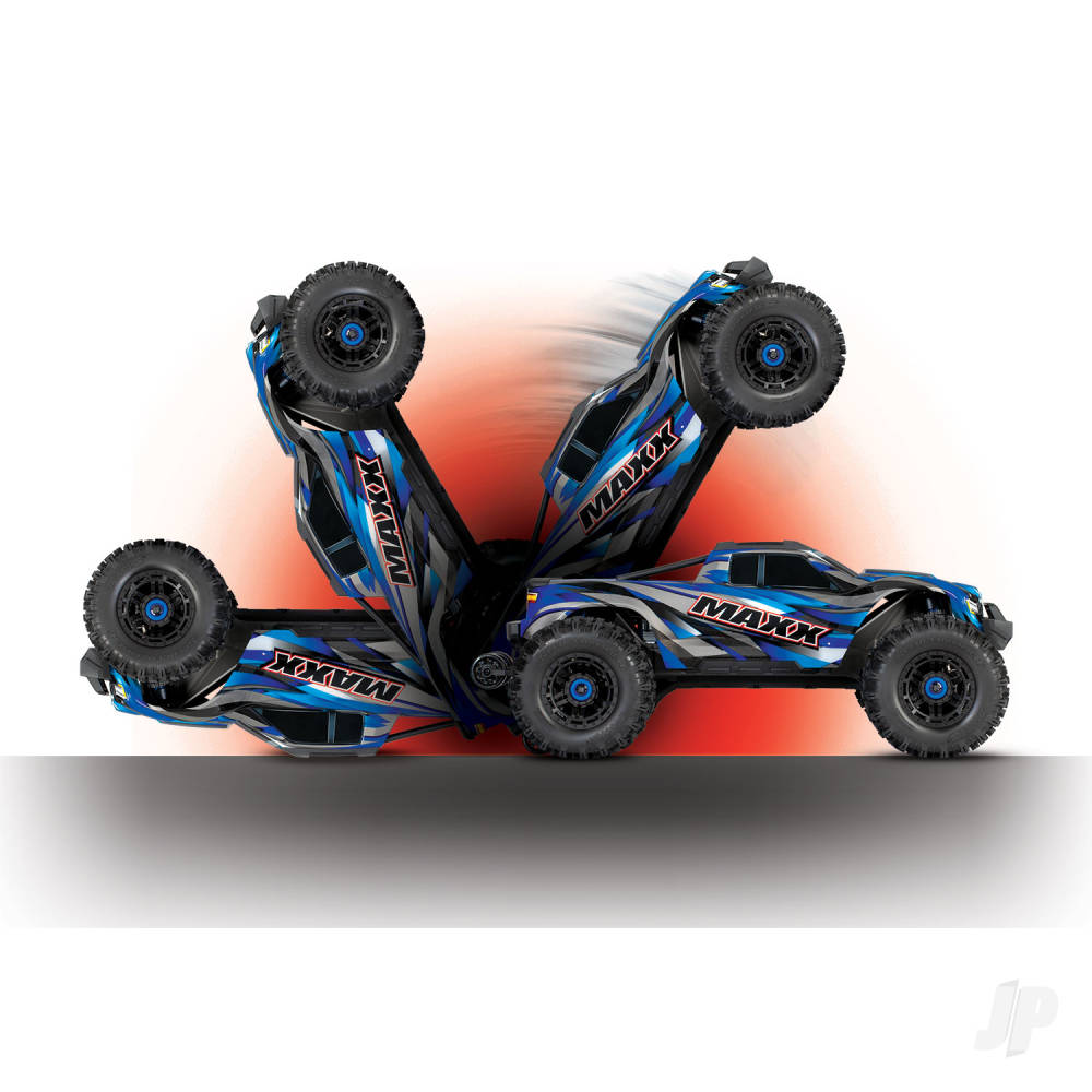 Traxxas Green Maxx monster truck performing tricks and stunts, showcasing its impressive capabilities and design.