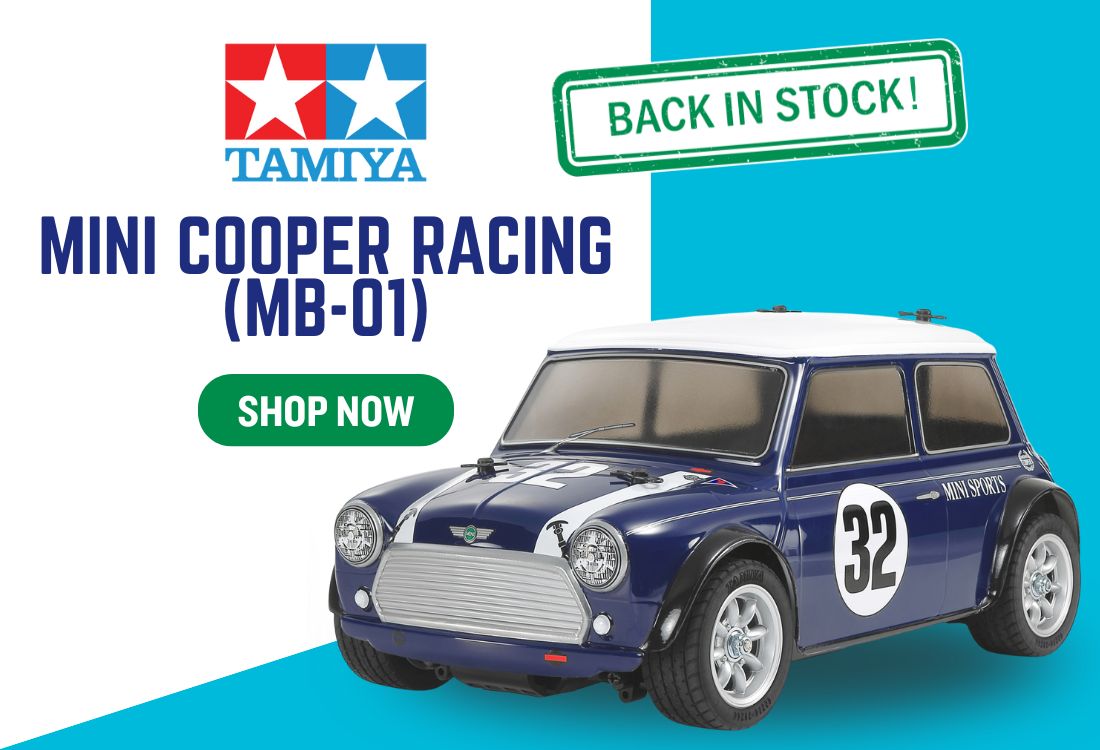 Model car with Tamiya branding and 'Back in Stock' text on a blue background