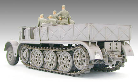 Tamiya German 18T Heavy Half Track model with soldiers seated on the back, showcasing detailed design and construction.