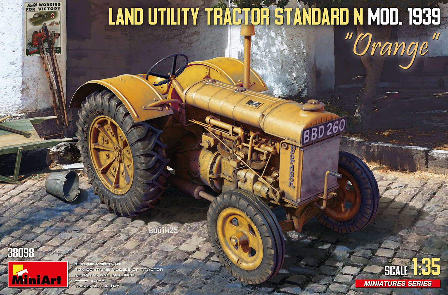 Model of a Land Utility Tractor Standard N Mod. 1939 on a cobblestone street with 'Orange' branding.