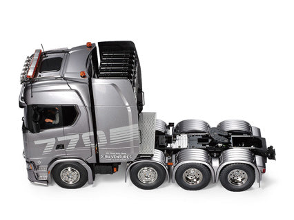 Tamiya Scania 8X4/4 56371 showcases the impressive Scania 770 S semi-truck design in stunning detail.