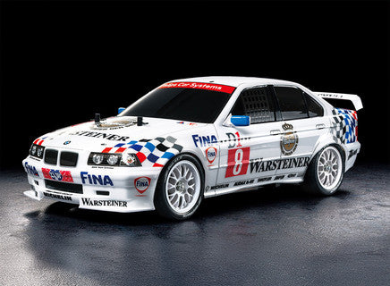 Tamiya Racing BMW car with various sponsor logos on a dark background