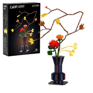 CaDA Oriental Floral Art Autumn set showcasing a colorful flower arrangement in a vase, with autumn leaves.