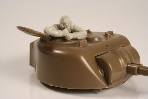 U.S. WWII Tank Commander in turret. Highly detailed figure of a U.S. tank commander. The figure should be placed in the tank´s turret. The commander is crouching in the turret and using the intercom. The figure hands are separate pieces.