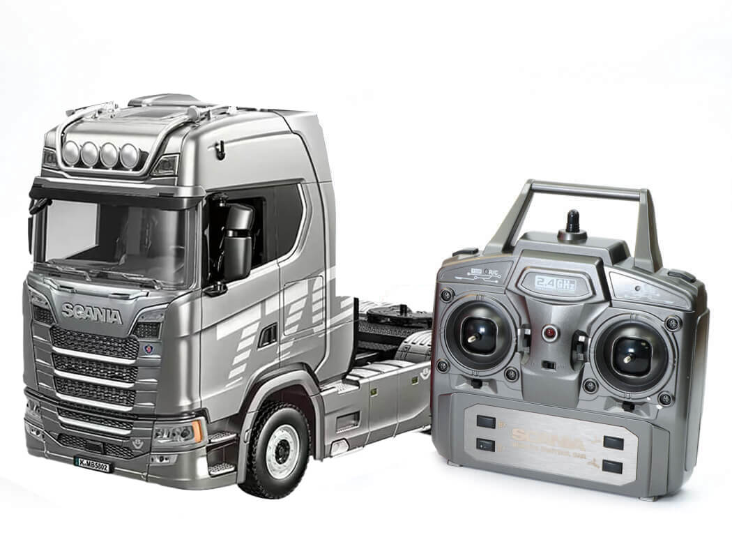 Model truck and remote control on a white background