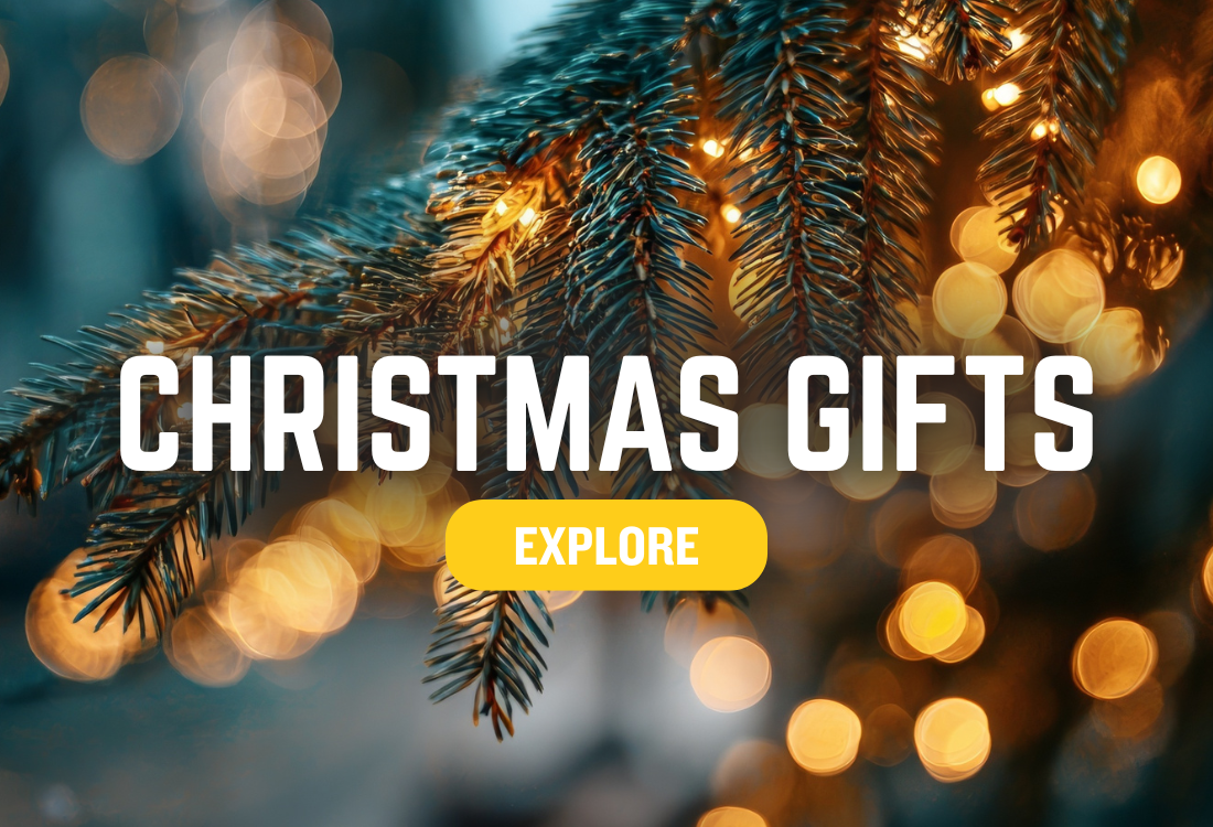 Decorative Christmas tree branch with lights and 'Christmas Gifts Explore' text on a blurred background.