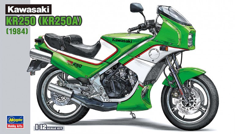 Model kit of a green Kawasaki KR250 motorcycle on a white background