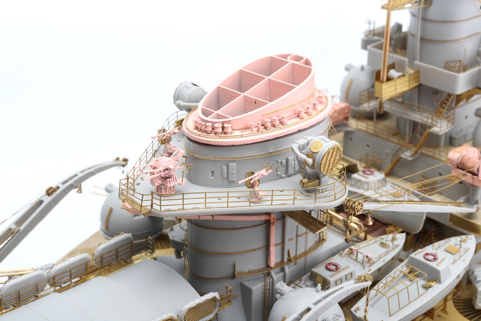 Close-up of DKM Scharnhorst model kit detailing showing brass parts and intricate design elements.