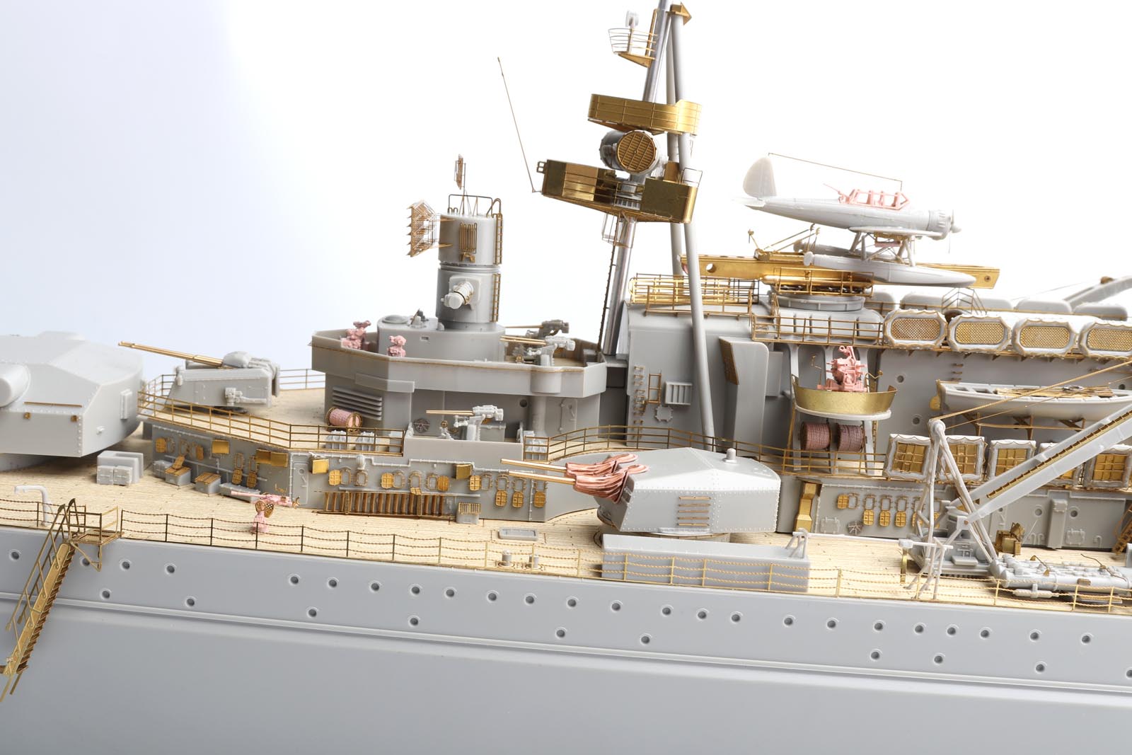 Detailed view of the DKM Scharnhorst model kit showcasing premium brass and wood parts.