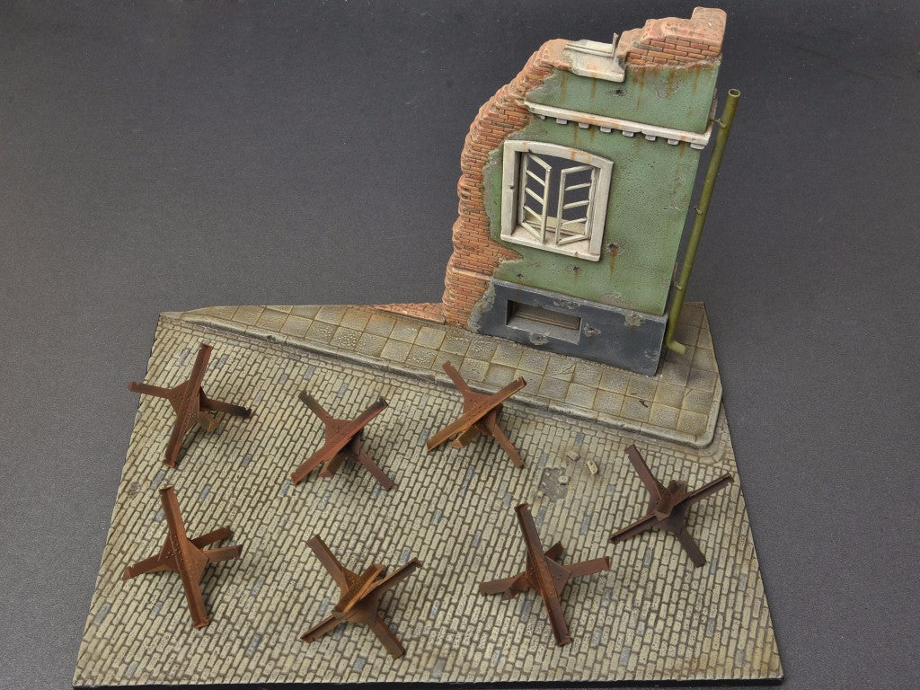 Anti-tank Obstacles. Kit contains 36 parts for assembling 12 models of Anti-tank Obstacles.