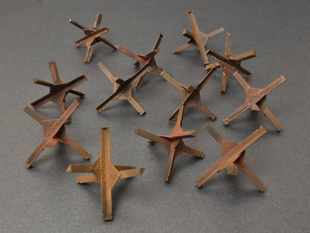 Anti-tank Obstacles. Kit contains 36 parts for assembling 12 models of Anti-tank Obstacles.