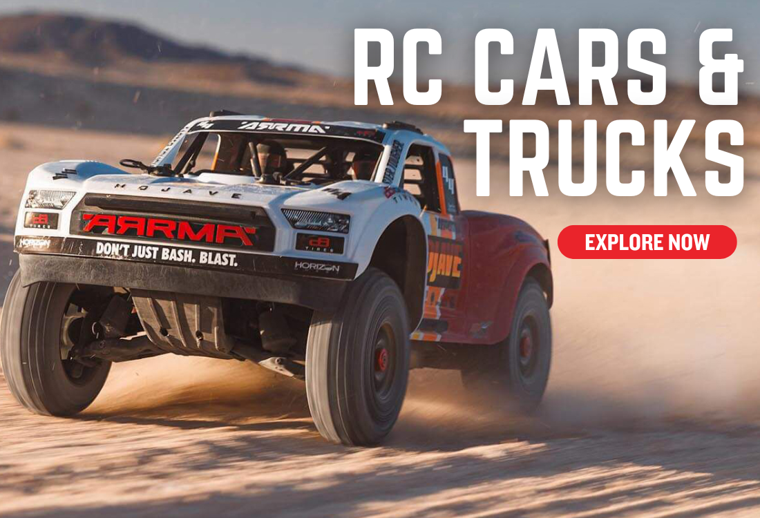 RC car and truck racing on a desert track with 'Arma' branding.