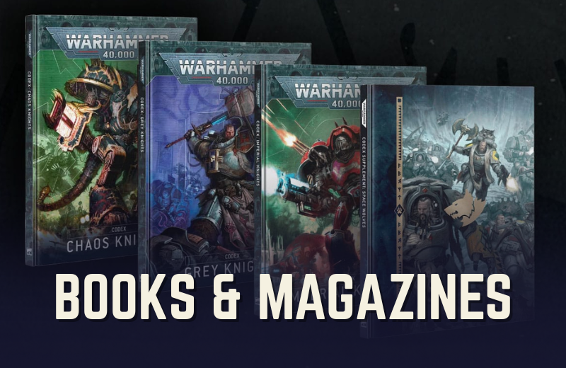 Four books or magazines with Warhammer 40,000 artwork on a dark background