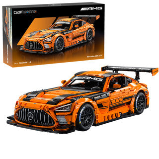 CaDa Mercedes-AMG GT3 model displayed next to its packaging in vibrant orange and black colors.