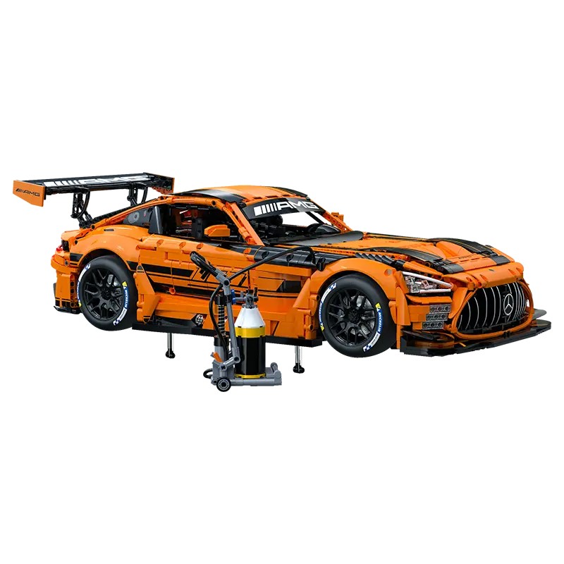 CaDa Mercedes-AMG GT3 model in striking orange and black colors with a pit stop setup.