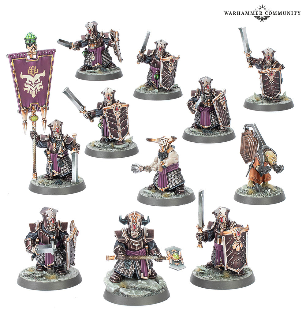 Collection of Warhammer figurines on a white background